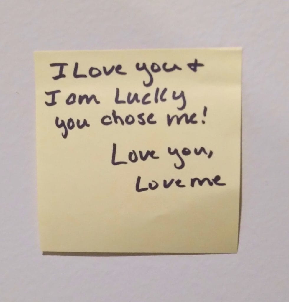 Yellow Post It with a note saying, "I love you and I am lucky you chose me! Love you, Love Me."